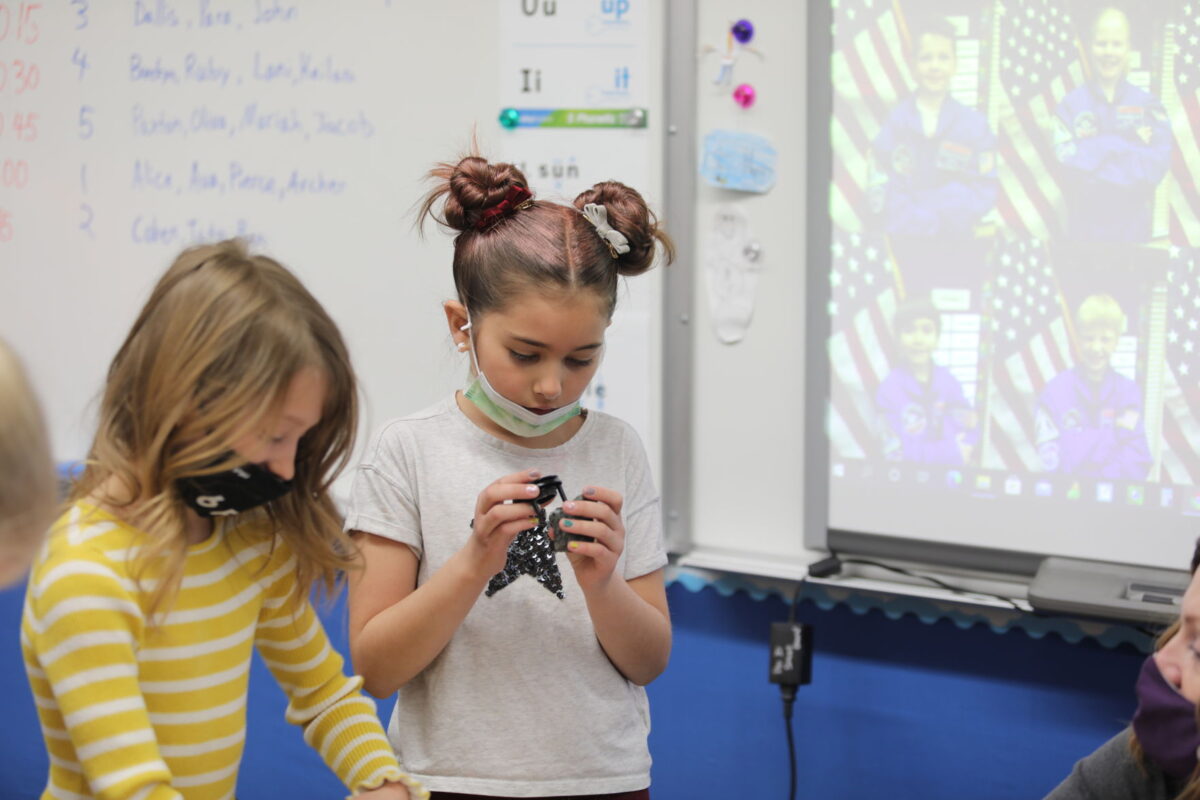Students at H. Guy Child Elementary observe moon rocks for Space Week ...